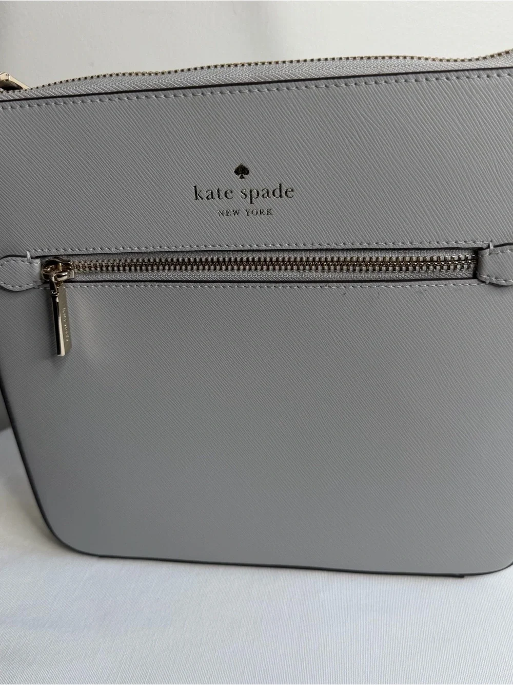 kate spade light gray saffiano leather messenger bag with gold hardware